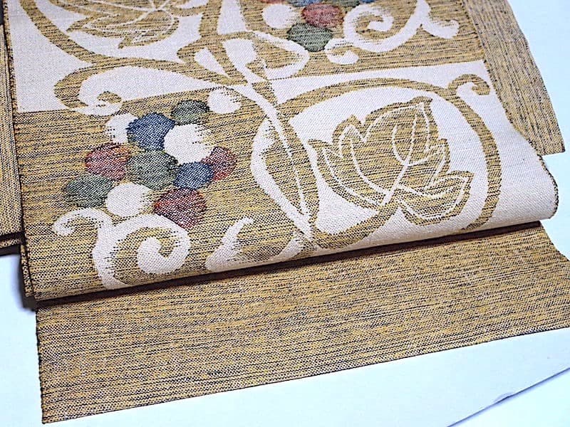 西陣織　紬八寸名古屋帯（市松に葡萄葉文）長366　三幸織物　正絹美品