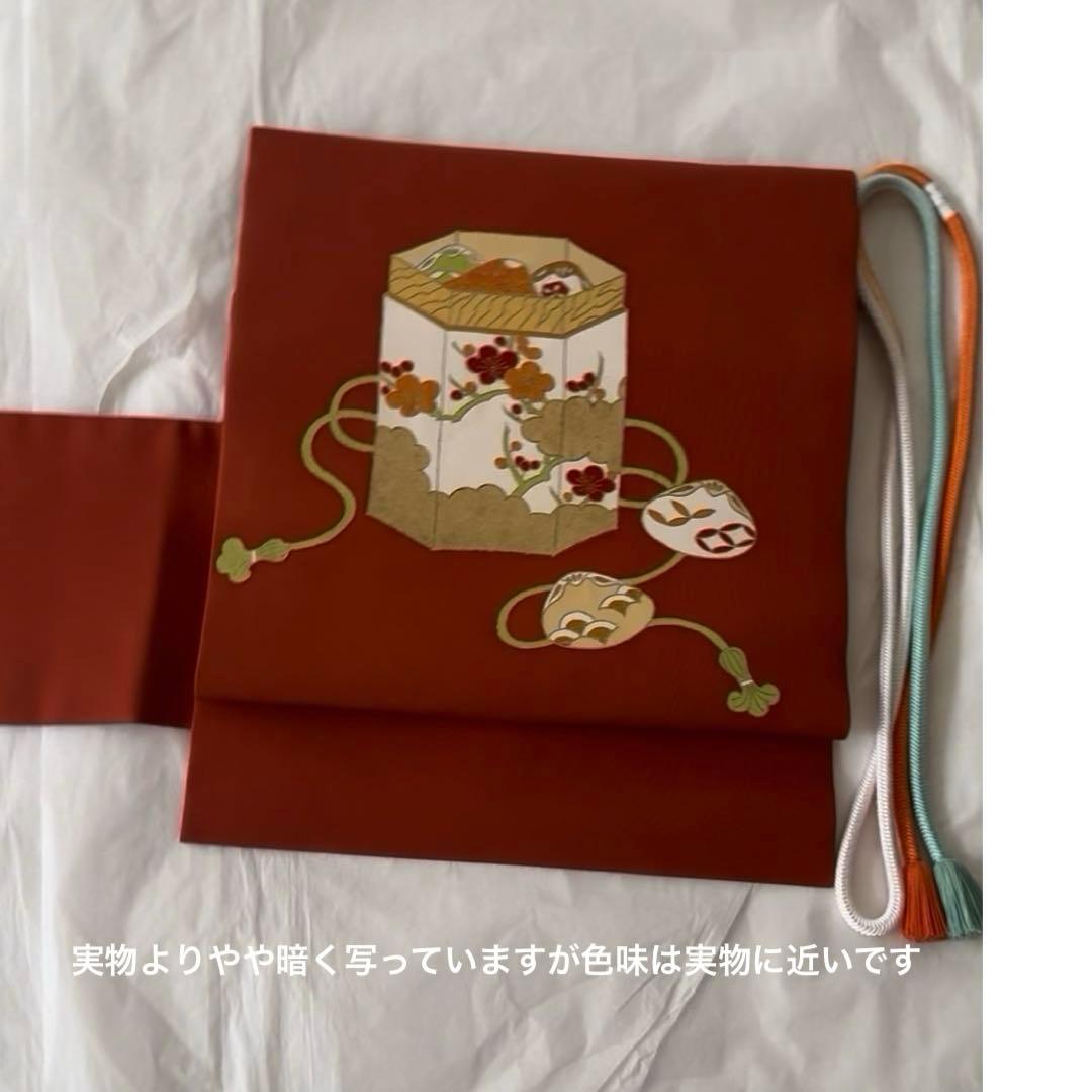 志ま亀　オレンジ地　塩瀬　名古屋帯　貝桶柄