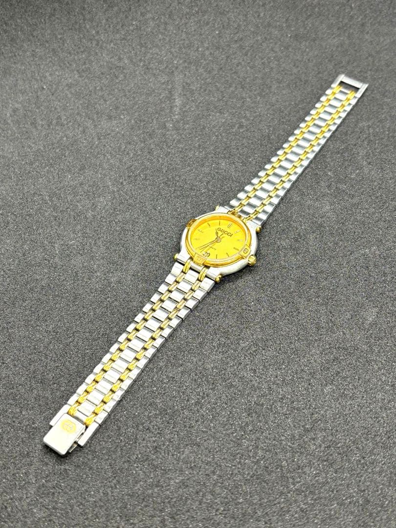 GUCCI 9000Lラウンドデイトゴールド文字盤 QZレディース腕時計 不動