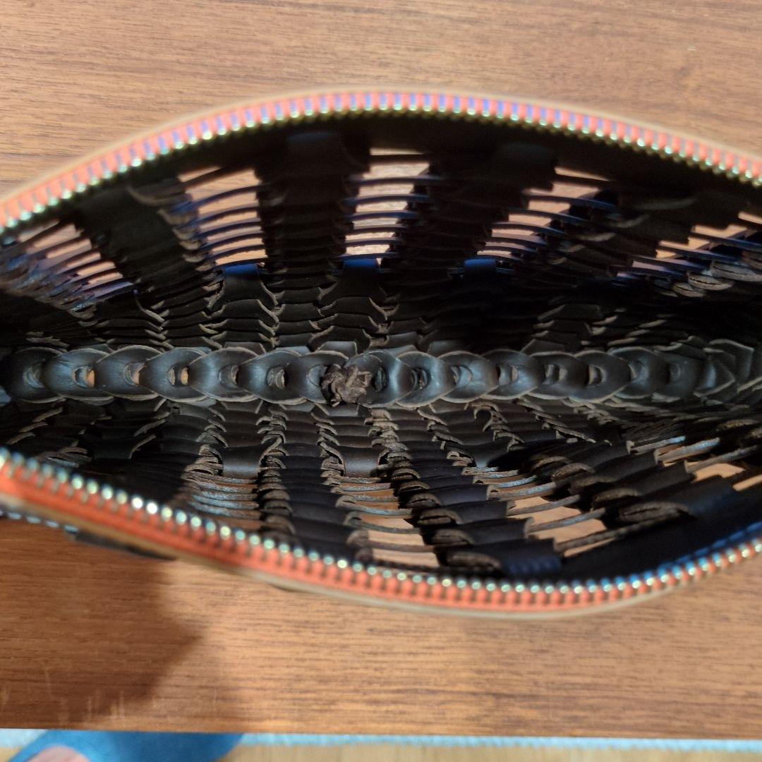 il micio イルミーチョ　BOHOブラウン　 編み込み クラッチバッグ