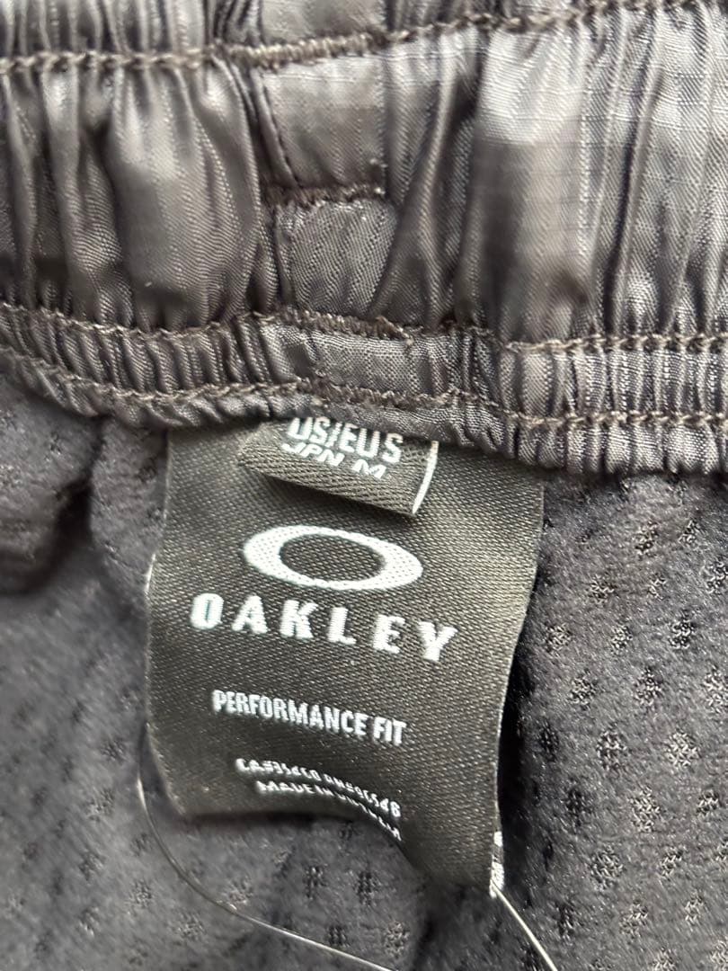 【新品未タグ付】オークリー ウインドブレーカー（上L・下M）保温 撥水 静音機能