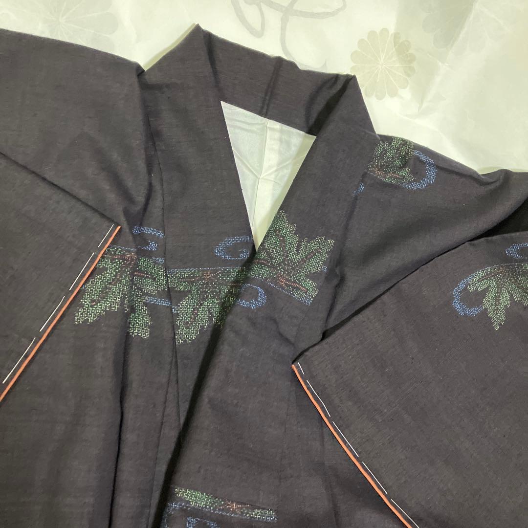 本場結城紬 重要無形文化財 地機 黒地 100亀甲 飛び柄 4色絣 未使用 美品