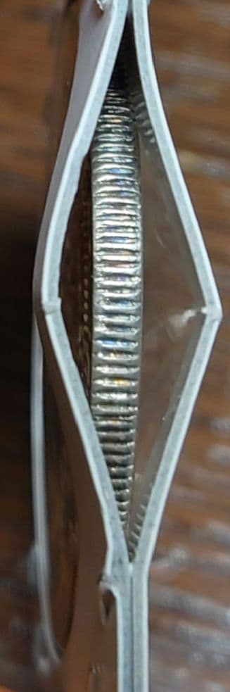 一圓銀貨　明治8年深彫り　左丸銀打ち