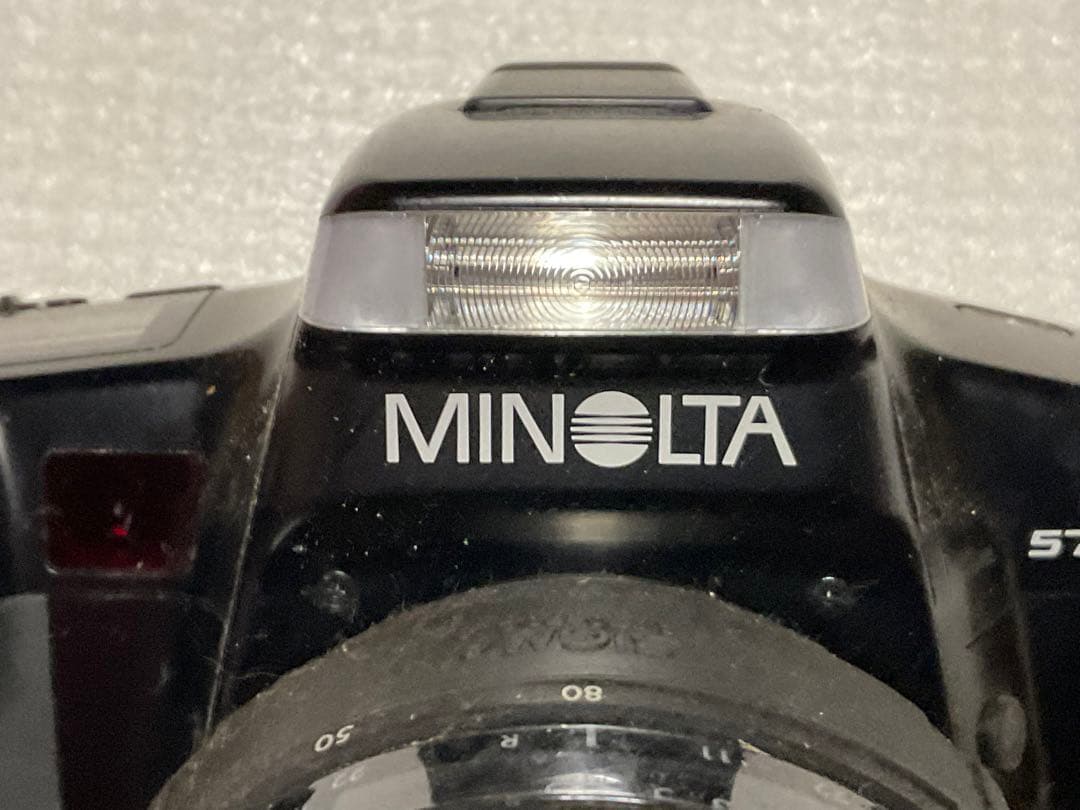 MINOLTA／アルファー・5700i。【シグマレンズ付き。持ち手僅かにキズ】。