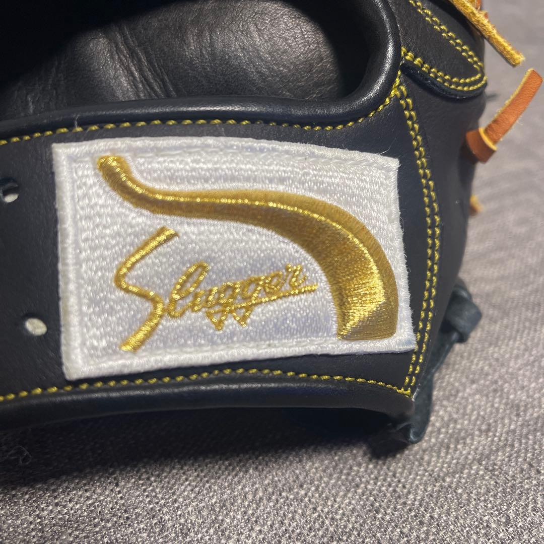 ず*な様 久保田スラッガー 軟式グローブ 黒/オレンジ　内野手用