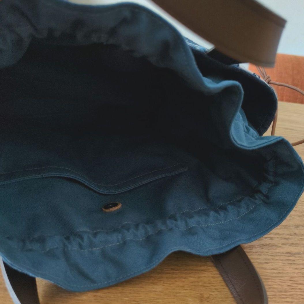 【1565】あおりポケットの巾着バッグ＊ミナペルホネン