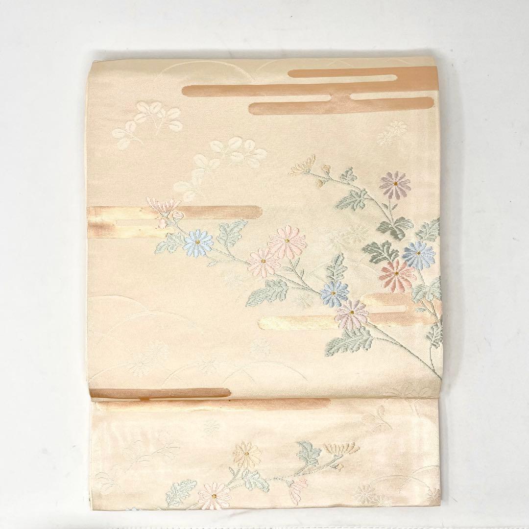 未使用［ 名古屋帯/ポリエステル ］東レシルック　生成り　菊　霞　芝草　洗える