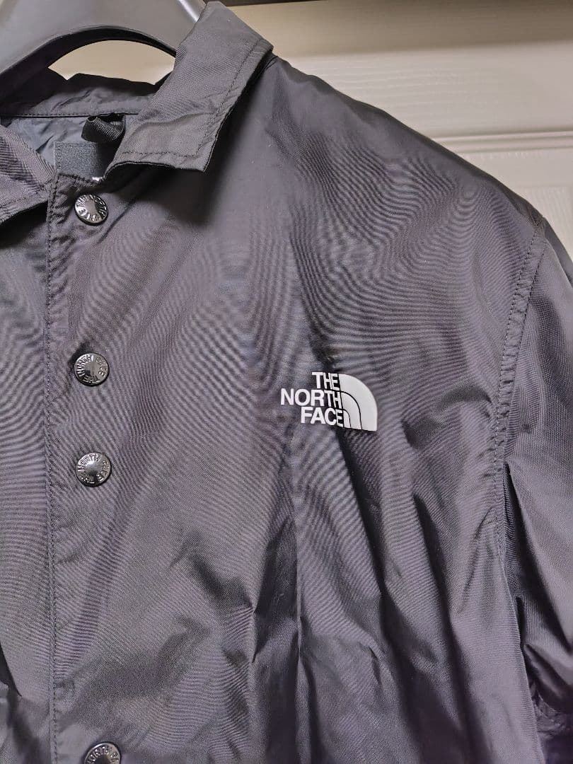 THE NORTH FACE ブラック ナイロンコーチジャケットNP21836
