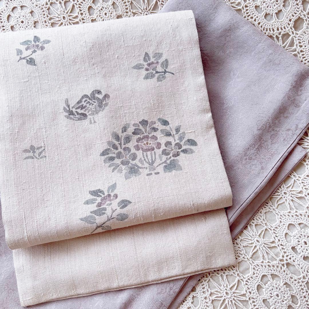 花と鳥の模様 くすんだピンクグレー ピンクベージュ 名古屋帯 紬帯