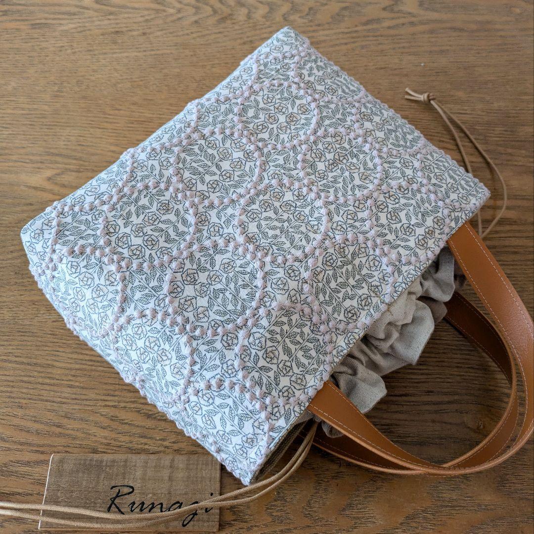 【1548】あおりポケットの巾着バッグ＊ミナペルホネン